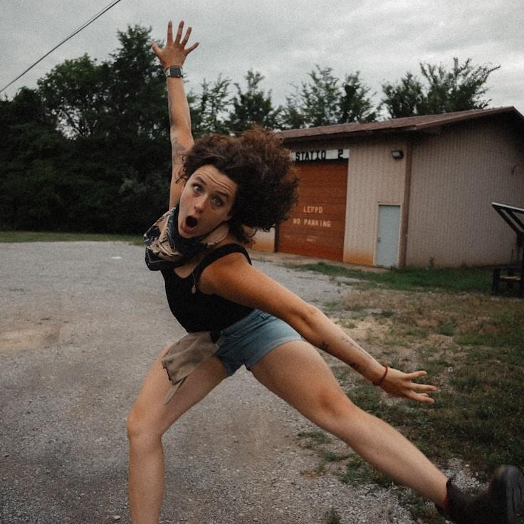 Kaveri Mehta, Lead Design Curator at Harvest Folio Helm, reviewing corporate floral arrangements